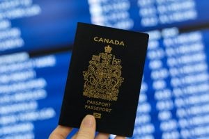 canadian-passport-in-hand-scaled